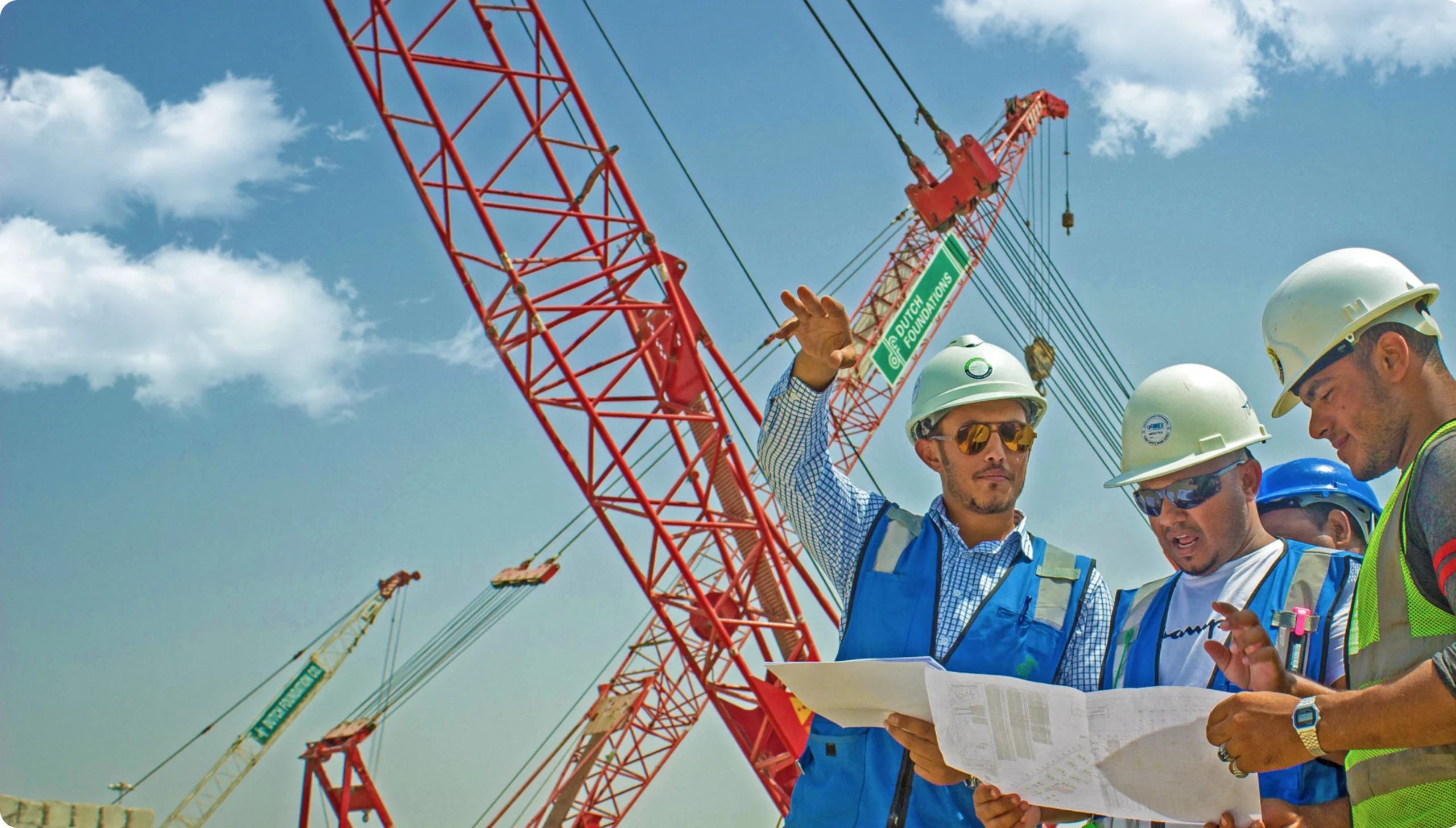 Construction engineers reviewing plans at Dutch Foundations