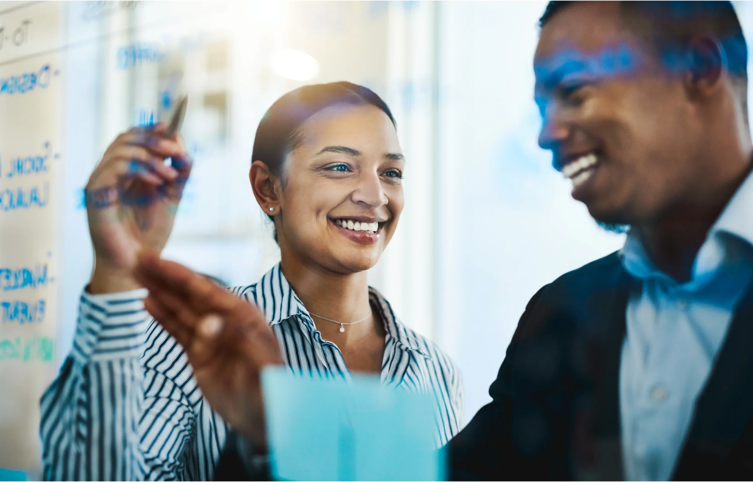 Business professionals collaborating on enterprise planning using Microsoft Dynamics 365 Finance and Supply Chain Management.